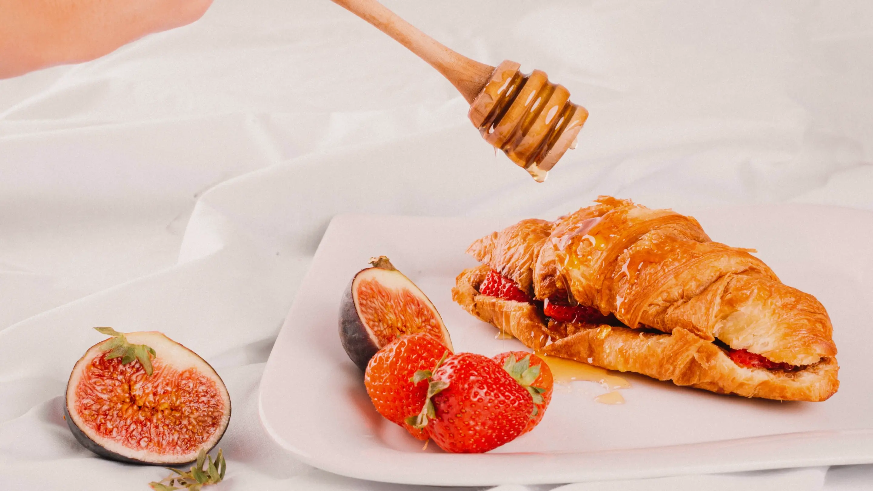 fruit croissant with honey and cream cheese